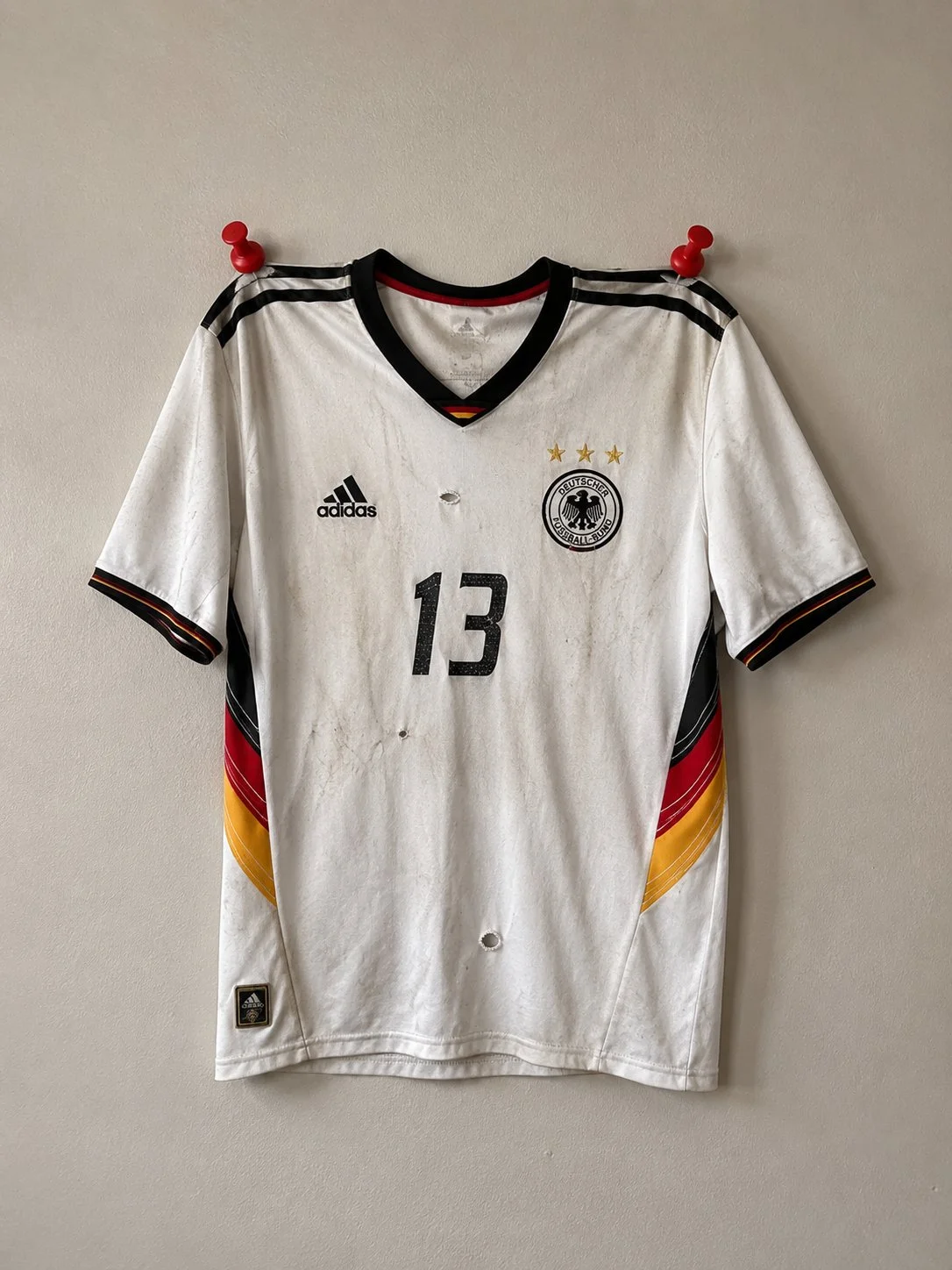 Jersey damaged by thumbtacks